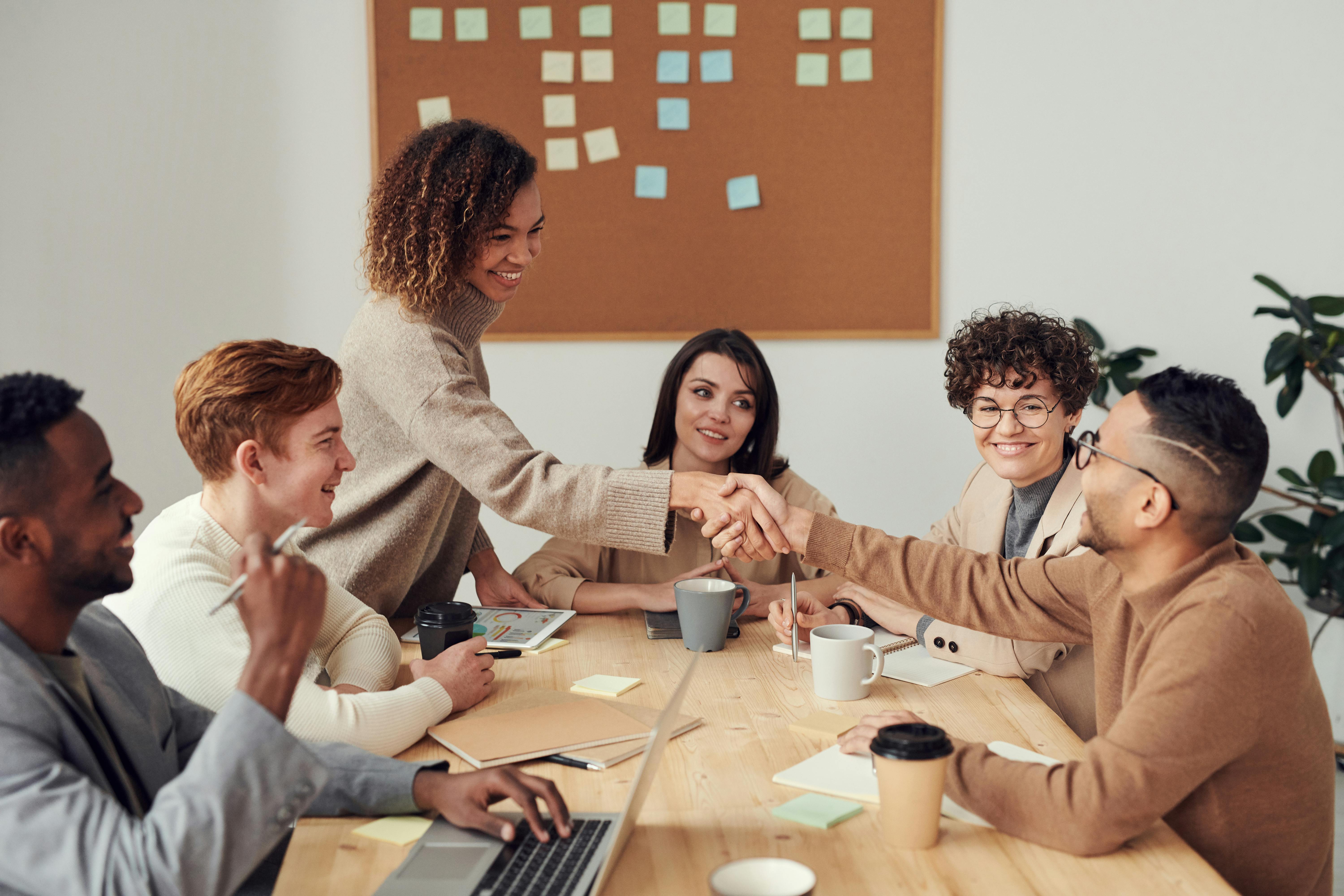 Female and male team at a table working
